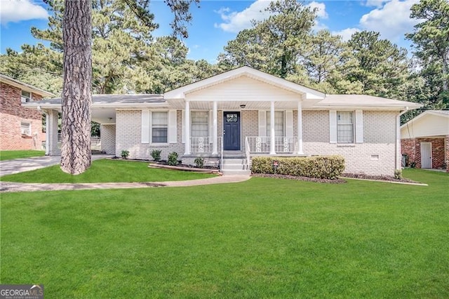 ranch-style house with covered porch and a front yard