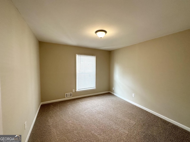 unfurnished room with carpet