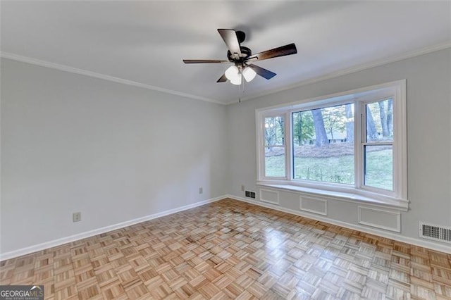 spare room featuring ceiling fan and ornamental molding