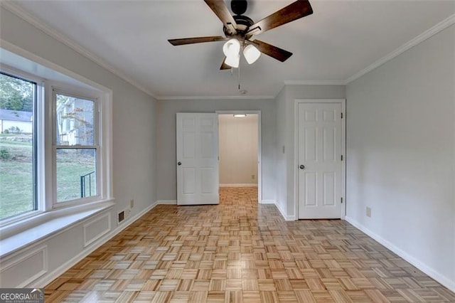 unfurnished bedroom featuring ceiling fan, ornamental molding, and light parquet floors