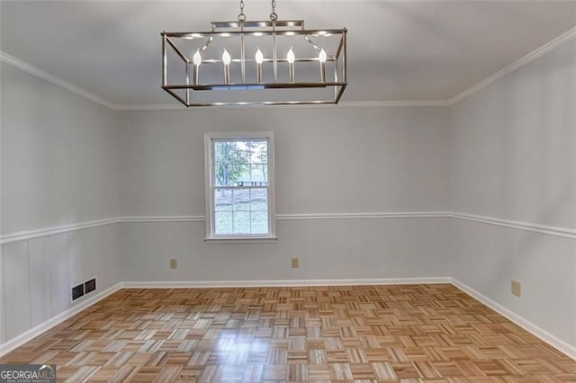 unfurnished dining area with ornamental molding and a notable chandelier