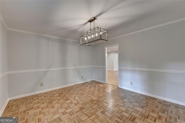 interior space with a chandelier, ornamental molding, and light parquet flooring