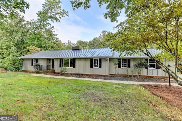 ranch-style house with a front lawn