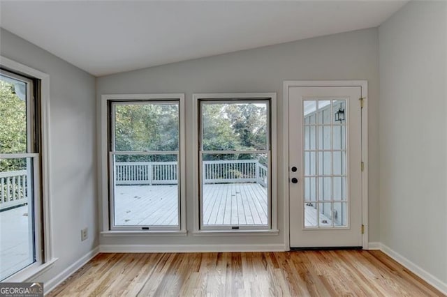 entryway featuring light hardwood / wood-style flooring and lofted ceiling