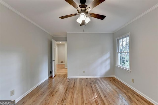 unfurnished room featuring crown molding, ceiling fan, and light wood-type flooring