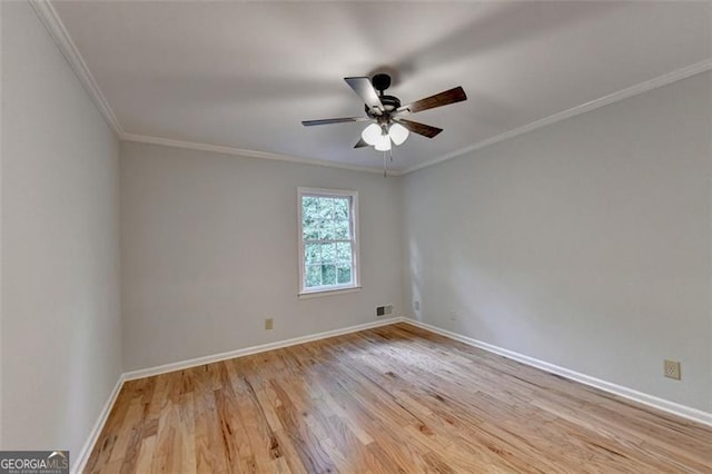 unfurnished room featuring ceiling fan, light wood-type flooring, and crown molding