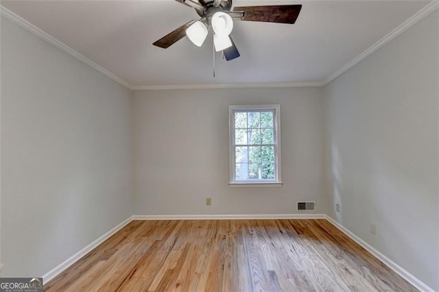 spare room featuring light hardwood / wood-style floors, ceiling fan, and ornamental molding