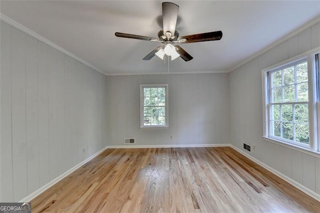 unfurnished room with light wood-type flooring, ceiling fan, and crown molding