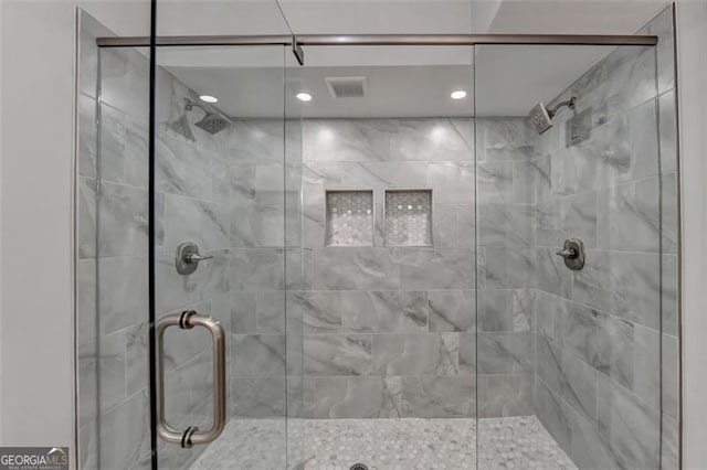 bathroom featuring an enclosed shower