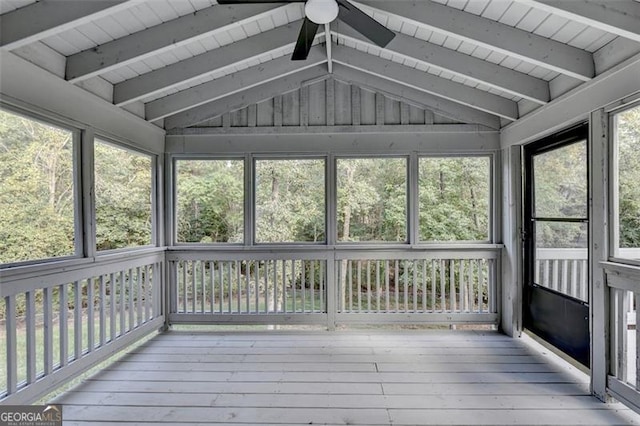 unfurnished sunroom with ceiling fan and lofted ceiling