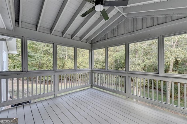 unfurnished sunroom featuring lofted ceiling with beams and ceiling fan