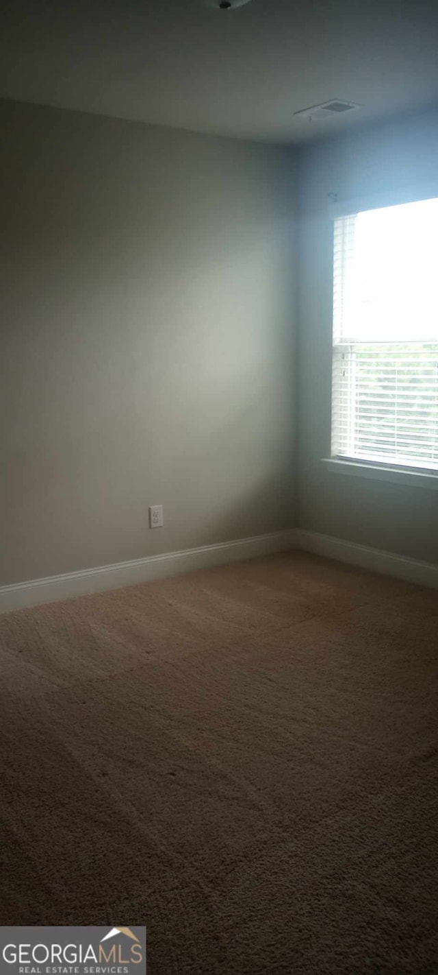 view of carpeted spare room