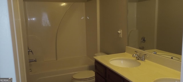 full bathroom featuring vanity, bathtub / shower combination, and toilet