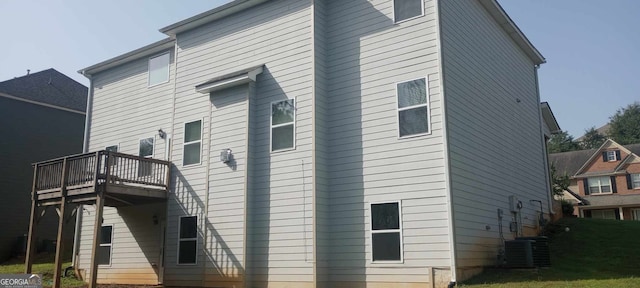 view of home's exterior with central air condition unit and a balcony