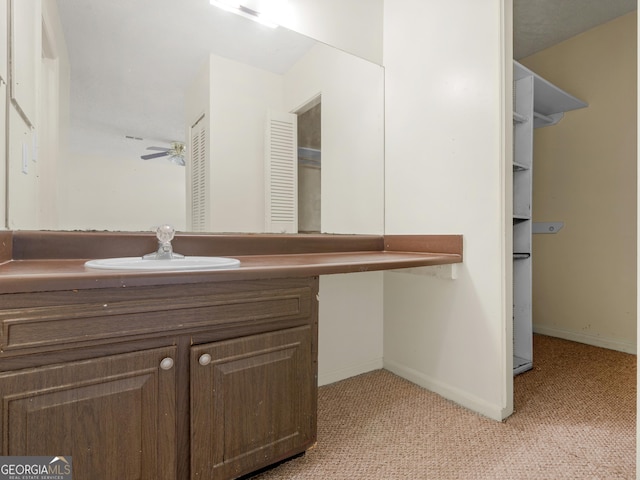 bathroom with vanity and ceiling fan