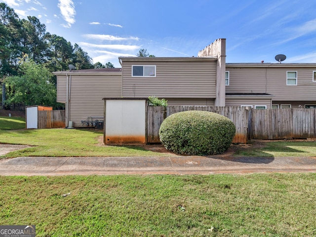 back of house with a yard