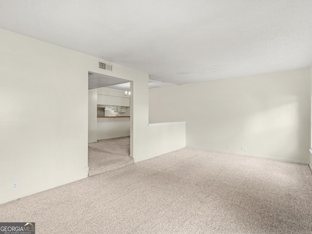 unfurnished room with carpet flooring