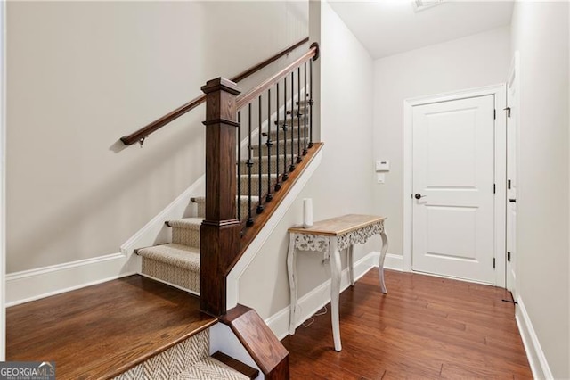 stairway featuring hardwood / wood-style flooring