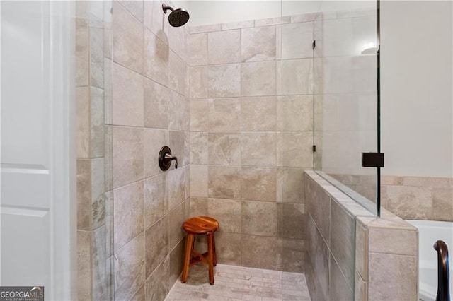 bathroom with tiled shower