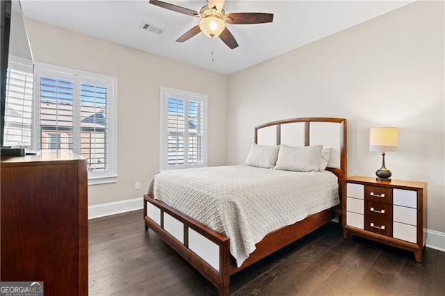 bedroom featuring dark hardwood / wood-style flooring and ceiling fan