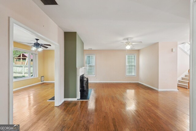 dining area with ceiling fan and hardwood / wood-style flooring