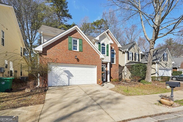 view of front of house featuring central AC unit and a garage