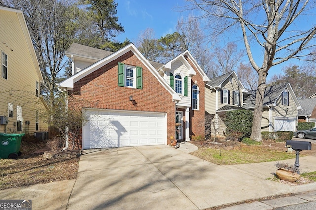 traditional-style home featuring a garage, concrete driveway, brick siding, and central air condition unit