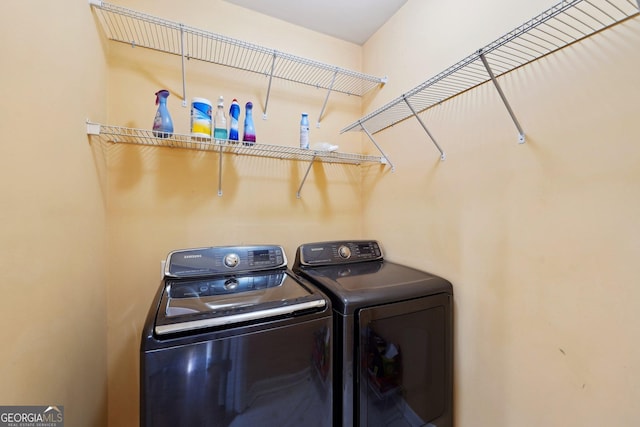 laundry room featuring laundry area and washing machine and clothes dryer