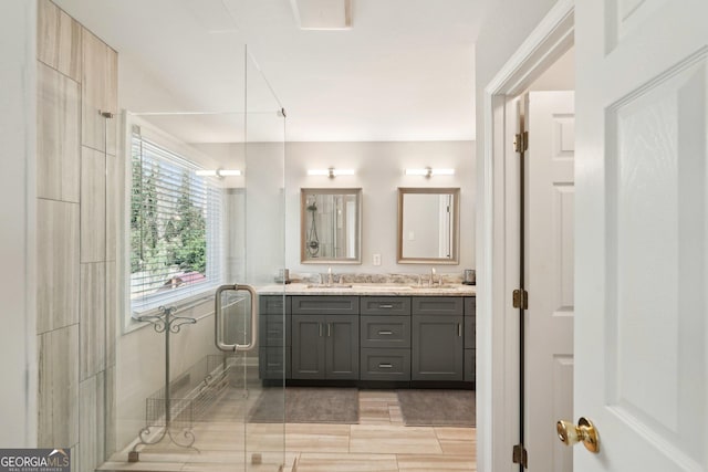 bathroom with double vanity and a sink