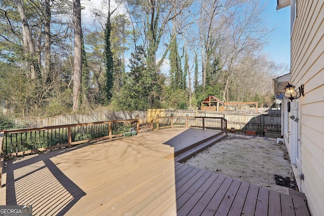 deck with a fenced backyard