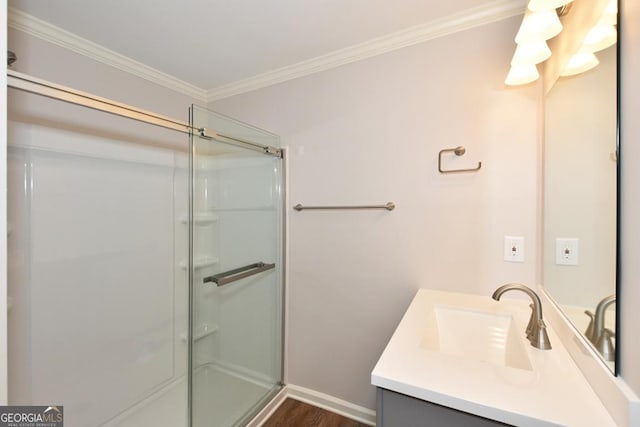 bathroom featuring vanity, wood-type flooring, ornamental molding, and walk in shower