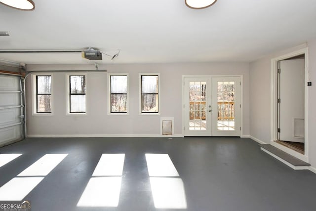 garage featuring a garage door opener and french doors