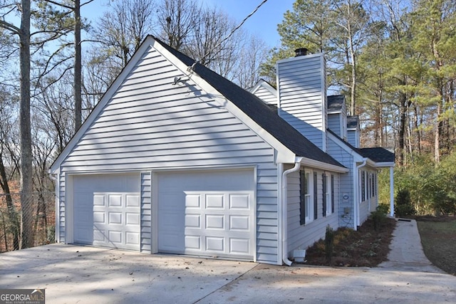 view of side of home with a garage