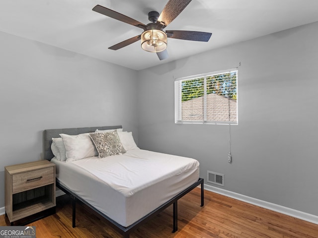 bedroom featuring ceiling fan and hardwood / wood-style floors