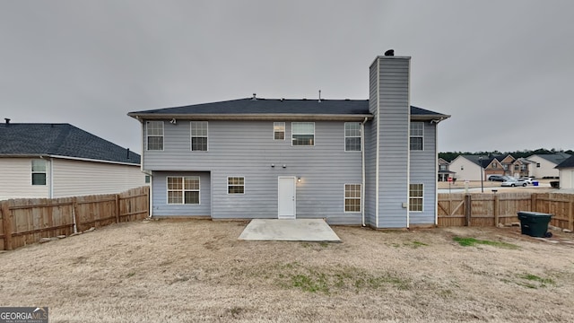 rear view of property featuring a patio