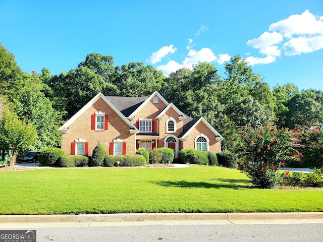 front facade featuring a front lawn