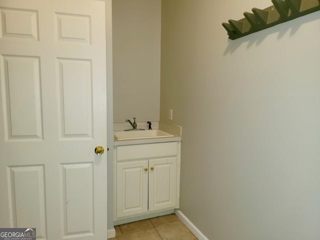 bathroom with tile patterned floors and vanity