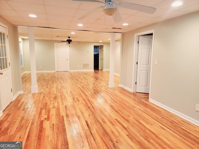 unfurnished room featuring a paneled ceiling and light hardwood / wood-style floors