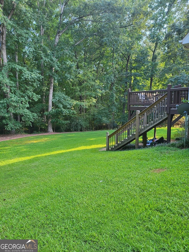 view of yard with a deck