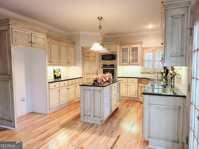 kitchen featuring backsplash, stainless steel appliances, crown molding, pendant lighting, and a center island