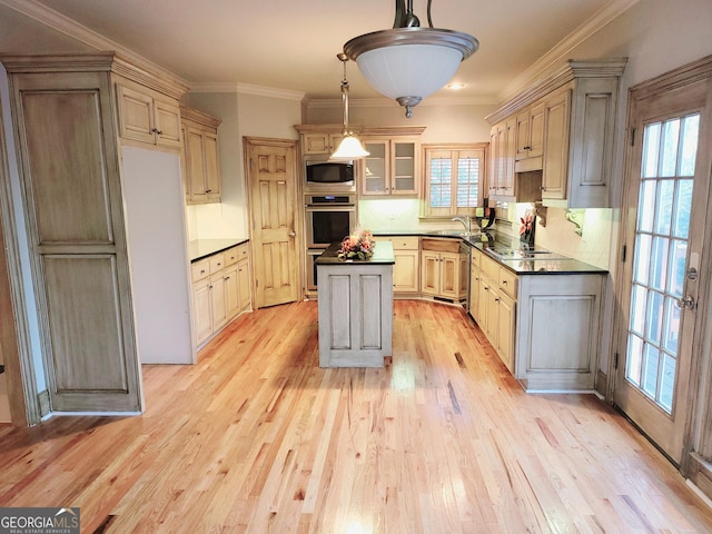 kitchen with backsplash, crown molding, hanging light fixtures, and stainless steel appliances