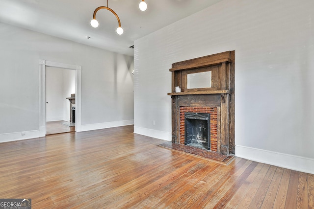 unfurnished living room featuring wood-type flooring