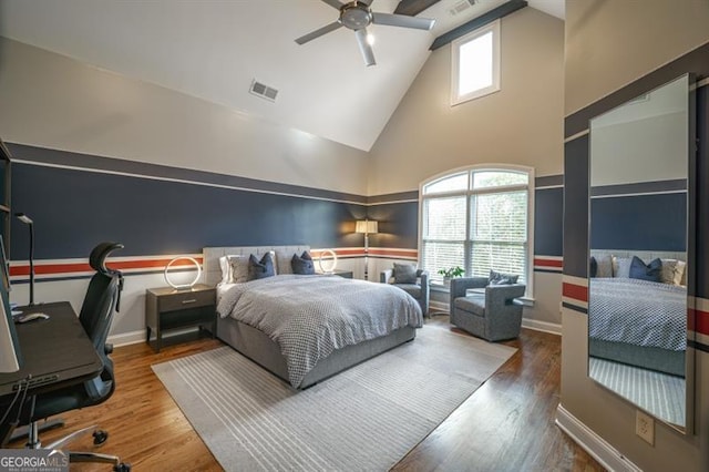 bedroom featuring ceiling fan, high vaulted ceiling, and hardwood / wood-style floors