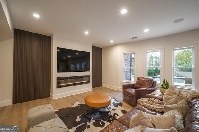 living room with light hardwood / wood-style floors