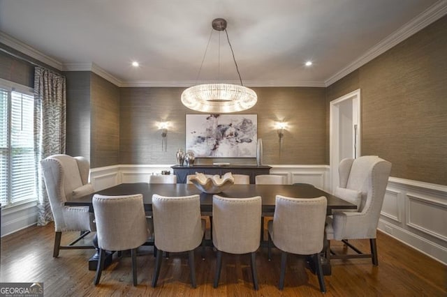 dining area featuring crown molding, dark hardwood / wood-style floors, and a chandelier