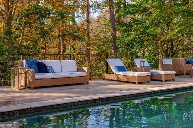 view of pool with an outdoor hangout area and a patio area