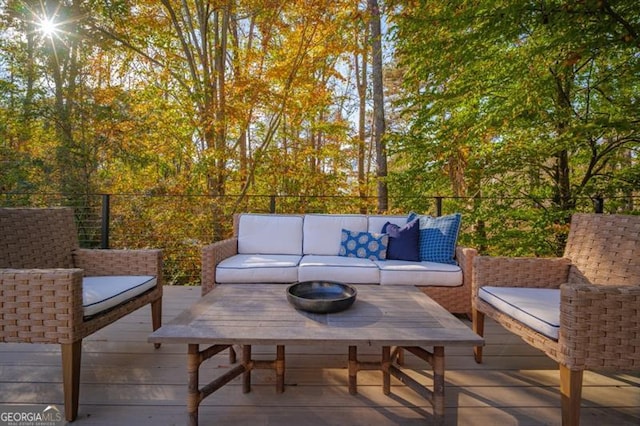 wooden deck featuring an outdoor living space and a patio area