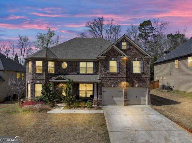 view of front of house with a lawn and a garage