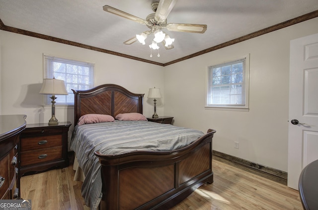 bedroom with ceiling fan, crown molding, and light wood-type flooring