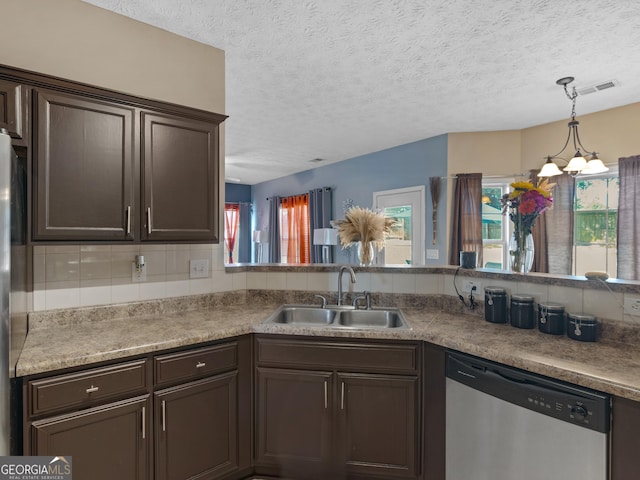 kitchen with a notable chandelier, dishwasher, a healthy amount of sunlight, and sink